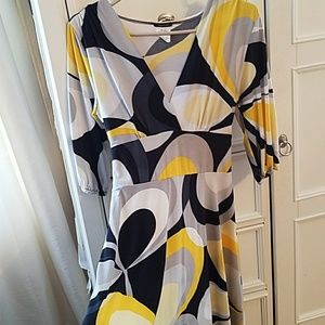 A black, white, and yellow knee length springdress